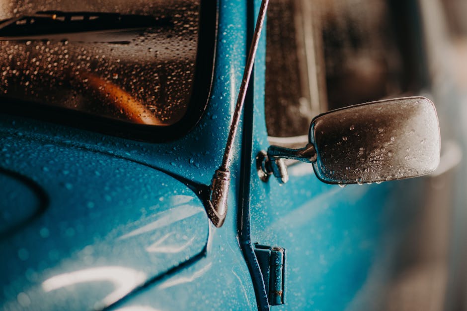 Water beading on a freshly detailed car exterior